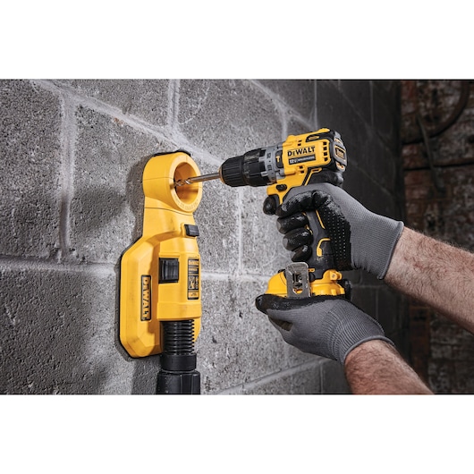 Brushless cordless hammer drill with battery drilling  floor.