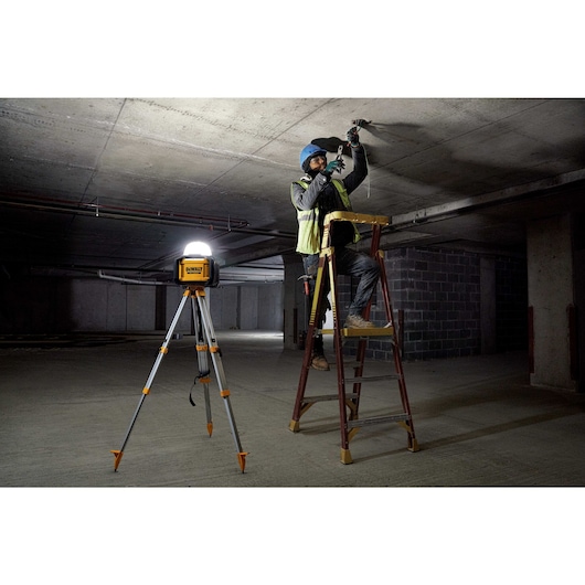 Tool Connect all purpose cordless work light being used by a maintenance worker