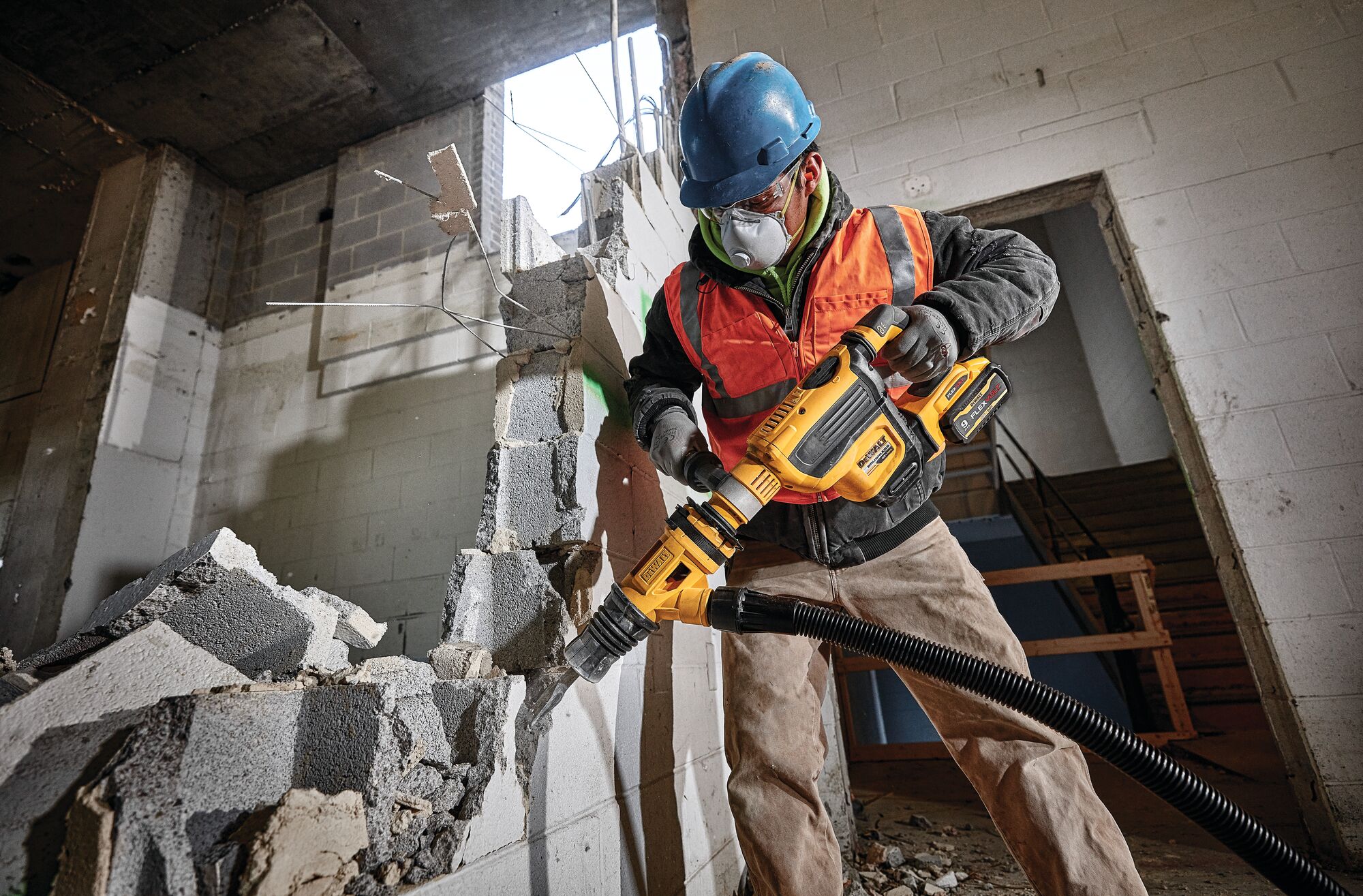 SDS MAX Brushless combination rotary hammer being used by a person