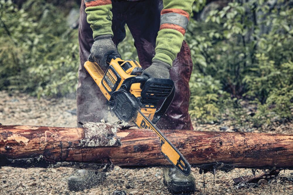 FLEXVOLT Cordless Chainsaw in use on a wooden log outdoors
