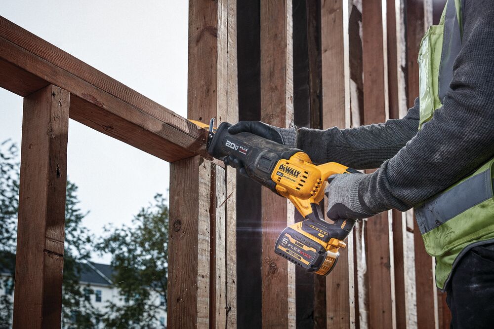 Brushless Cordless Reciprocating Saw with FLEXVOLT ADVANTAGE being used on a wooden frame structure outdoors