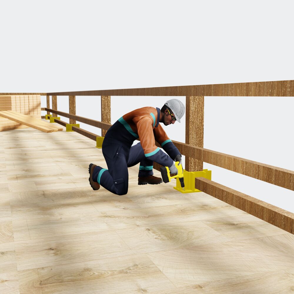 A carpenter installing temporary safety railings