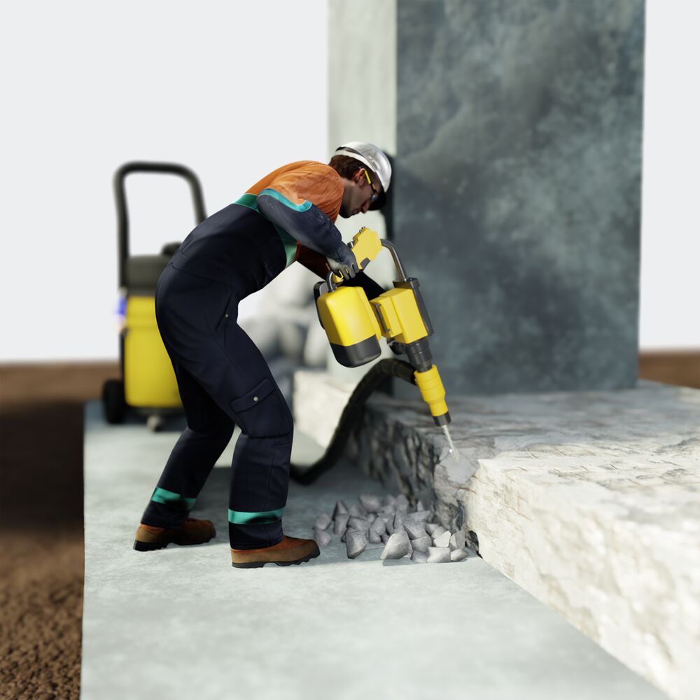 A contrator demolishing a concrete structure
