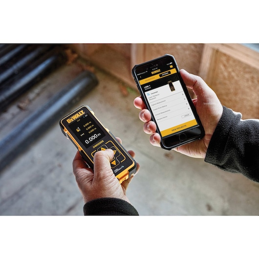 DEWALT tool connect laser distance measurer being connected to a smart phone.
