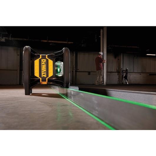 Tool connect green tough rotary laser being used at a construction site.
