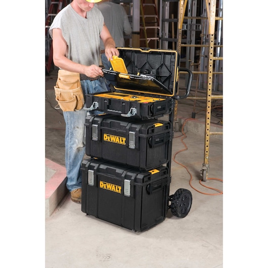 tough system DS carrier with three cases attached to it in use at a worksite.