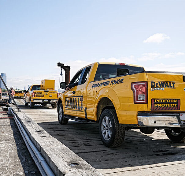 The back of a DEWALT branded F150 truck heading to a jobsite